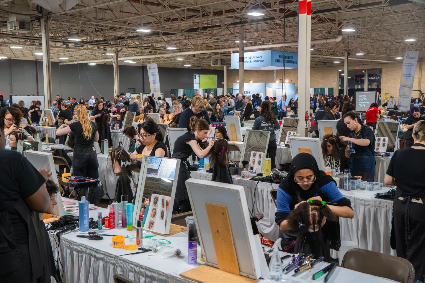 Busy hairstyling competition at a convention centre