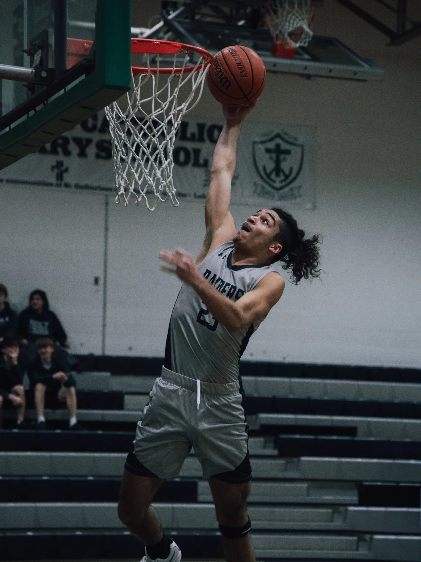 Basketball player rising for a dunk
